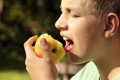 kid eating fruit